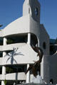 Dolphin statue & freeform parking structures opposite Aquarium of Pacific. Long Beach, CA.