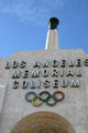Olympic torch tower over central entrance arch of Memorial Coliseum. Los Angeles, CA.