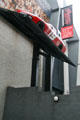 Racing cars mounted on exterior wall of Petersen Automotive Museum. Los Angeles, CA.