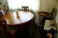 Dining table in parlor of Nixon Birthplace where Nixon learned to debate politics. Yorba Linda, CA.