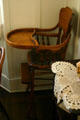 Wooden high chair in parlor of Nixon Birthplace used by Richard Nixon & his brothers. Yorba Linda, CA.