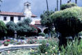 Gardens in cloister of Mission San Juan Capistrano. Capistrano, CA.