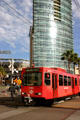 Trolley passes The Metropolitan. San Diego, CA