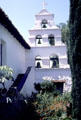 San Diego Mission adobe wall with bells seen from garden side. San Diego, CA.