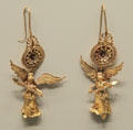 Greek gold & glass earrings with Nike pendants at Getty Museum Villa. Malibu, CA.