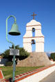 Bell tower at San Bernardino Asistencia with El Camino Real road marker. Redlands, CA.
