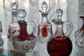 Red trimmed glass cruets at Historical Glass Museum. Redlands, CA.