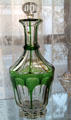 Green overlay cut to clear glass decanter in colonial style at Historical Glass Museum. Redlands, CA.