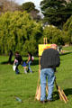 Painter works at easel on lawn of Palace of Fine Arts. San Francisco, CA.