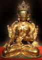 Buddhist deity White Tara gilded copper statue from Nepal at Asian Art Museum. San Francisco, CA.