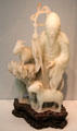 Carved Nephrite jade in shape of envoy Su Wu herding goats from China at Asian Art Museum. San Francisco, CA.