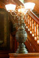 Bronze combined gas & electric lamp on staircase at Haas-Lilienthal House. San Francisco, CA.