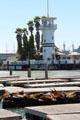 Forbes Island tower off Pier 39 over sea lions on dock. San Francisco, CA.