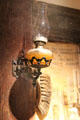 Glass kerosene wall lamp at Mariposa Museum. Mariposa, CA.