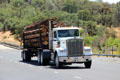 Logging truck traveling along HW 49. Coulterville, CA