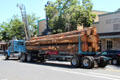 Log truck driving through Angels Camp on HW 49. Angels Camp, CA.