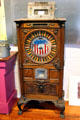 Antique ornate wooden slot machine with image of Admiral Dewey at Angels Camp Museum. Angels Camp, CA.