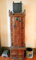 Antique tall clock in unusual case at Calaveras County Downtown Museum. San Andreas, CA.