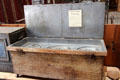 Chuck wagon food chest, a type of slow cooker, with inset food containers at Red Barn Museum. San Andreas, CA.