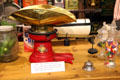 Candy scale with brass bowl & decorated red base at El Dorado County Historical Museum. Placerville, CA.