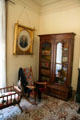 Bedroom with cradle, rocker & book case at Bidwell Mansion house museum. Chico, CA.
