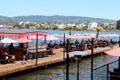 Lake Chalet docks with restaurant tables. Oakland, CA.