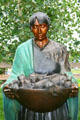 Beauty of the Harvest sculpture showing Pueblo woman with corn by Martha Pettigrew at Leanin' Tree Museum. Boulder, CO