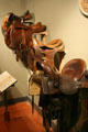 Saddle collection at El Pomar Carriage Museum. Colorado Springs, CO.