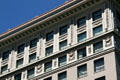 Upper story carving details of former First National Bank, now Magnolia Hotel. Denver, CO.