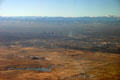 Aerial view of Denver against the Rocky Mountains. Denver, CO