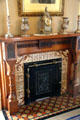 Fireplace with Minton tiles showing fables at Byers-Evans House. Denver, CO.