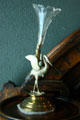 Silver crane holding vase at Byers-Evans House. Denver, CO.
