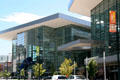 14th Street facade of Colorado Convention Center with blue bear sculpture. Denver, CO.