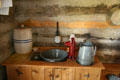 Kitchen water pump of settler's log cabin at Clear Creek History Park. Golden, CO.
