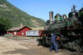 Engineer prepares steam locomotive of Georgetown Loop Railroad. Silver Plume, CO.