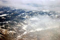 Mist-covered Rocky Mountains from air. CO.
