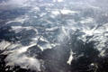 Snow-covered Rocky Mountains & valleys from air. CO.