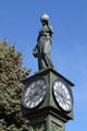 Statue of woman holding lamp atop Wheeler Town Clock. Manitou Springs, CO.
