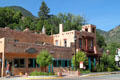 Adobe-style commercial building seen against Pikes Peak. Manitou Springs, CO.