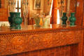 Carved fireplace mantle with green ceramic vases at Rosemount House Museum. Pueblo, CO.