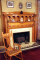 Fireplace & rocking chair at Rosemount House Museum. Pueblo, CO.
