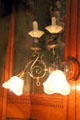 Combination gas & electric sconces in dining room at Rosemount House Museum. Pueblo, CO.
