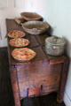 Wooden storage chest with wooden bowls & crock at Baca Adobe House. Trinidad, CO.