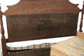 Back of wooden headboard with original shipping label at Baca Adobe House. Trinidad, CO.