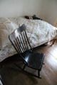 Bed & rocking chair at Baca Adobe House. Trinidad, CO.