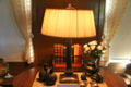 Table lamp with collection of Oriental bronzes at Hill-Stead Museum. Farmington, CT.