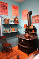 Display of late 1800s domestic items with cast-iron wood stove by Walker & Pratt of Boston at Connecticut Historical Society. Hartford, CT.