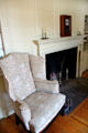 Parlor with upholstered wing chair at Dr. Hezekiah Chaffee House. Windsor, CT.