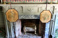 Parlor fireplace with Adamsesque carvings plus embroidered firescreens at Phelps-Hathaway House. Suffield, CT.
