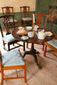 Round tea table with chairs & tea service at Silas Deane House. Wethersfield, CT